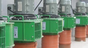 Martin Lishman agricultural cooling fans outside a grain store as part of a FloorVent system.