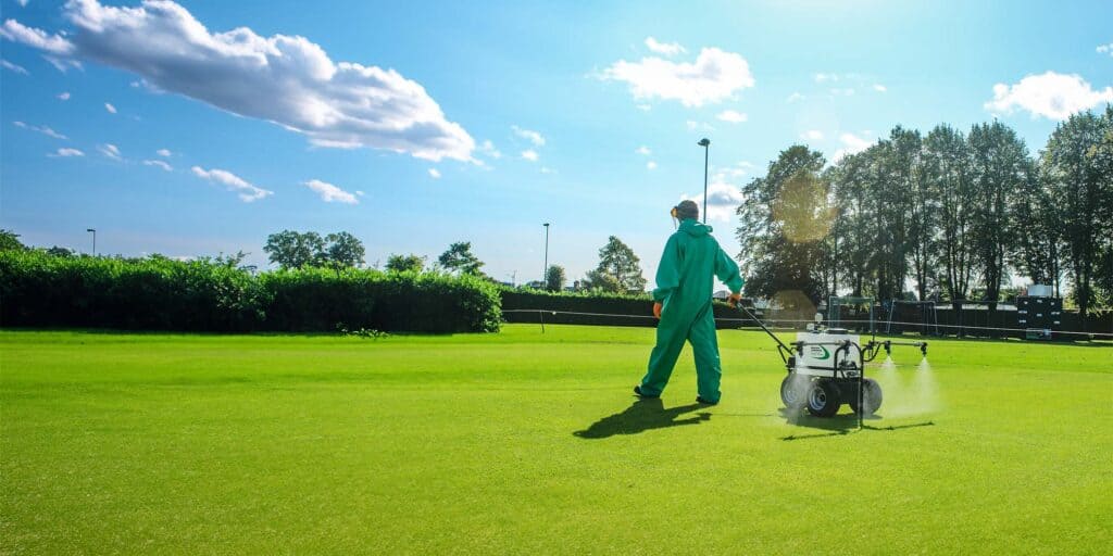 The Nano-Spray self-propelled pedestrian sprayer sprays a cricket green.