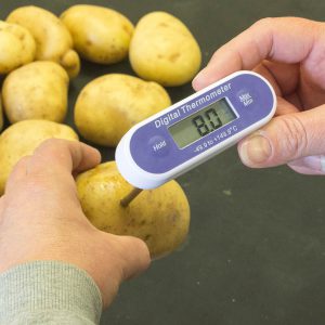 Potato Thermometer in a potato reading the temperature of the potato